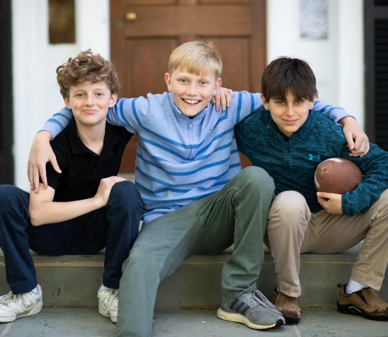 3 Keswick students sitting on steps